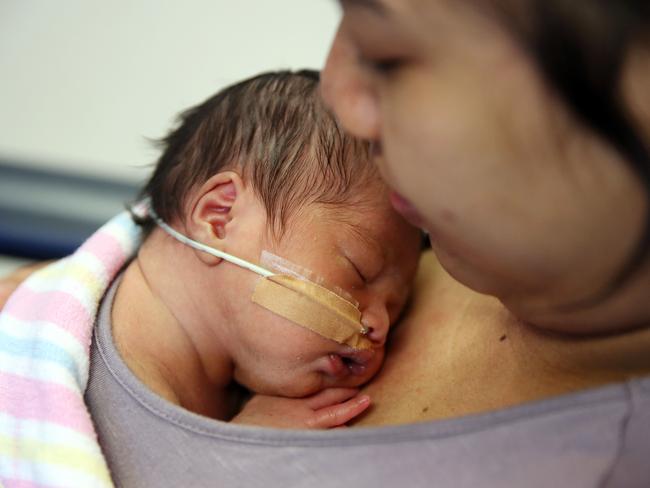 Chea Chansocheat with her newborn son Anthony at Fairfield Hospital enjoying skin-to-skin contact as part of Kangaroo Care. Picture: Tim Hunter.