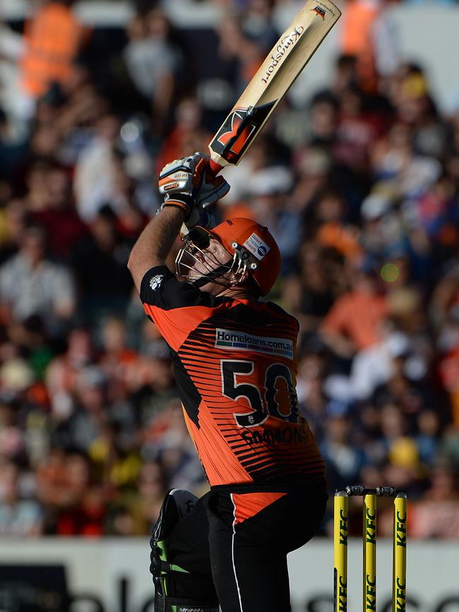 Craig Simmons launches a huge shot for Perth Scorchers during his BBL career.