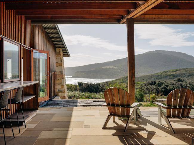 Roaring Beach House on the Tasman Peninsula exterior. Home is made of Buckland sandstone with external cladding of macrocarpa pine. MUST CREDIT Adam Gibson. For TasWeekend Travel story ONE-TIME USE ONLY for re-use must contact mag editor Kirsty Eade