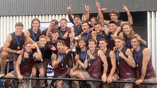 Old Haileybury celebrate after winning the VAFA Premier B flag in 2022.