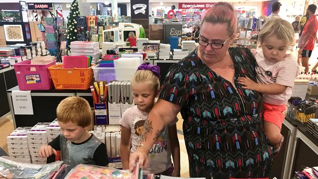 Natasha James and children Tyler, Isabella and Shelby Bruce shop for school supplies at the Back to School Outpost at Mount Pleasant Shopping Centre.