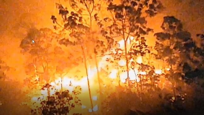 Queensland Police released Polair vision of the Lower Beechmont bushfire, captured between 11.45pm on Friday and 4am on Saturday.