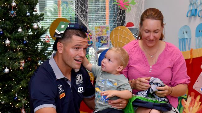 Cowboys Braidon Burns paid a surprise visit to patients, including Rene Ramsay with Bobby, 20 months from Junevale Station in Mareeba Shire, at the Childrens' Ward at the Townsville University Hospital. Picture: Evan Morgan