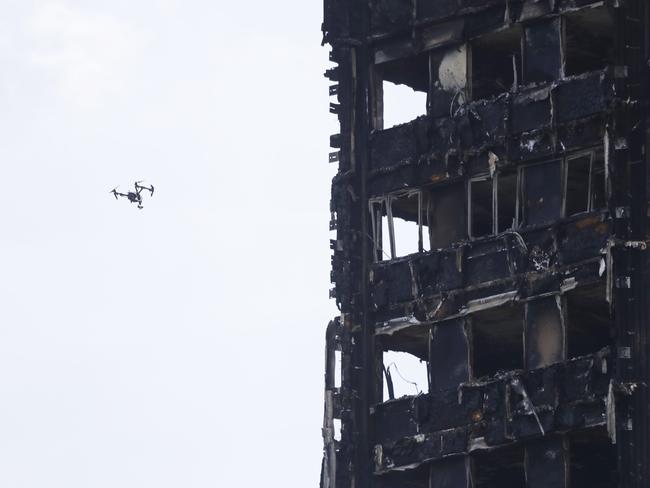 A drone flies past the London tower building. Picture: AP