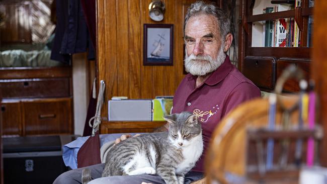SYDNEY, AUSTRALIA, NOVEMBER 22, 2023. Sylph VI skipper and owner Robert â€˜Bobâ€™ Williams with his cat Oli who will sail with Bob in the Sydney to Hobart yacht race on board Sylph VI. Photographer: Adam Yip