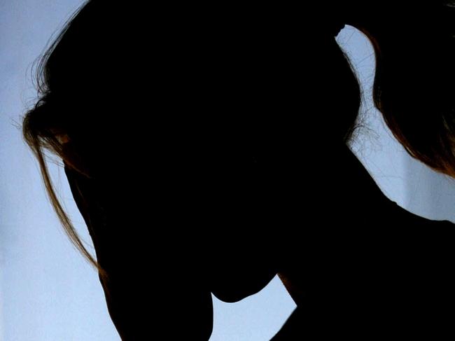 30/11/2007 FEATURES: Silhouette - generic of woman female crying, feeling sad and emotional.