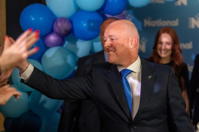 New Zealand's National Party leader Christopher Luxon celebrates their results in the general election on Saturday in Auckland