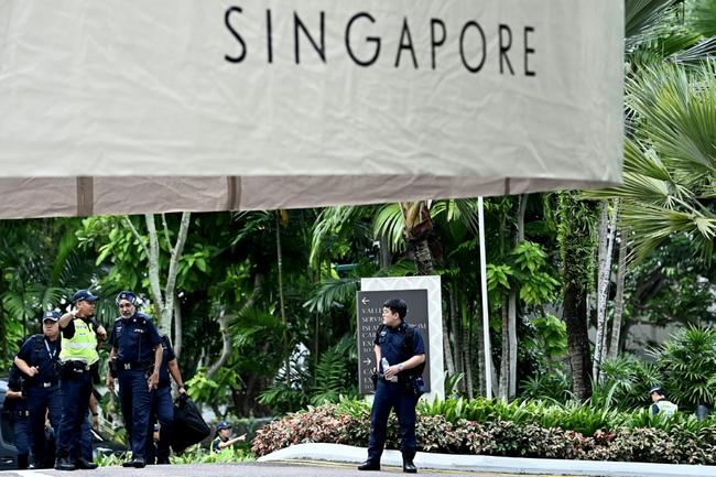 Policemen are seen at the Shangri-La Hotel during the 21st Shangri-La Dialogue summit in Singapore