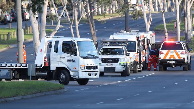 Authorities have closed part of Wellington Rd in both directions following a deadly crash involving a motorcyclist and a truck. Picture: David Crosling