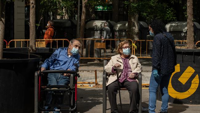 An elderly couple enjoy the fresh air in Barcelona. Picture: Getty Images