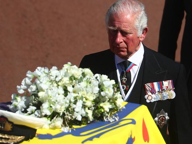 Britain's Prince Charles, Prince of Wales walks behind the coffin of Britain's Prince Philip, Duke of Edinburgh during a ceremonial funeral procession to St George's Chapel in Windsor Castle in Windsor, west of London, on April 17, 2021. - Philip, who was married to Queen Elizabeth II for 73 years, died on April 9 aged 99 just weeks after a month-long stay in hospital for treatment to a heart condition and an infection. (Photo by HANNAH MCKAY / POOL / AFP)