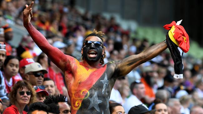 A PNG fan watches the Rugby League World Cup quarter finals match between Papua New Guinea and England at AAMI Park in Melbourne, Sunday, November 19, 2017. (AAP Image/Joe Castro) NO ARCHIVING, EDITORIAL USE ONLY