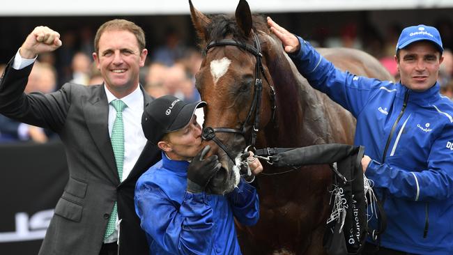 Trainer Charlie Appleby, jockey Kerrin McEvoy and strapper Nick Van Eeden celebrate the Melbourne Cup win with Cross Counter.