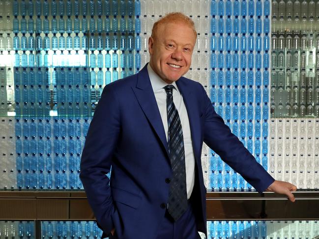 28/11/2018: Anthony Pratt in front of a wall of plastic bottles at the Visy office in Melbourne. Stuart McEvoy/The Australian.