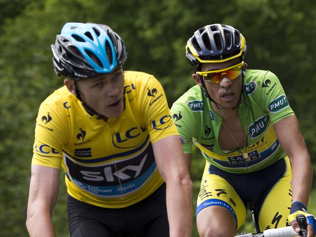 Overall leader Britain's Christopher Froome (L) and Spain's Alberto Contador ride during the second stage of the 66th edition of the Dauphine Criterium cycling race between Tarare and Col du Beal, central France, on June 9, 2014. AFP PHOTO / LIONEL BONAVENTURE