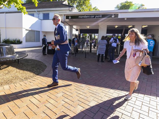 Early arrivals make their way through the gates at Flemington Racecourse. Picture: Daniel Pockett/Getty Images