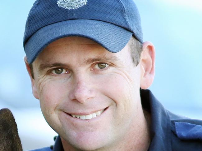 Pride of Australia nominee Senior-Constable Ash Purvey with 3 year old Astro stopped a speeding unmanned car from crashing through an intersection near Inala. Pics Tara Croser.