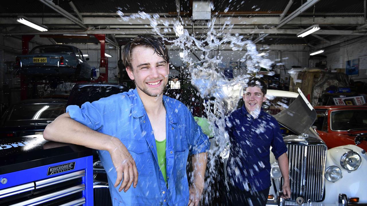 Mechanic Shaun Buckley cools down with the help of Steve Manuel at their workplace, Price Alexander Motors, Westbourne Park. Picture: Bianca De Marchi