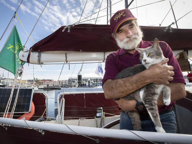 Sylph VI, Robert Williams, with shipmate, Oli the cat. Picture: Chris Kidd