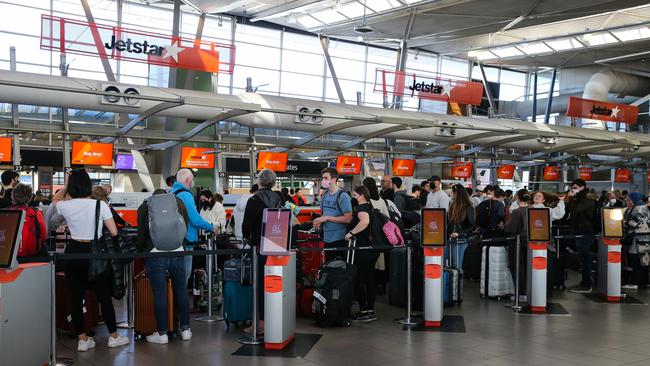 SYDNEY, AUSTRALIA - NCA NewsWire Photos - July 25, 2022: Chaos at Sydney Domestic Airport again today as travellers are seen lining up in long queues inside the terminal at the check in counter for jetstar after waiting outside in the long queues. Picture: NCA Newswire / Gaye Gerard