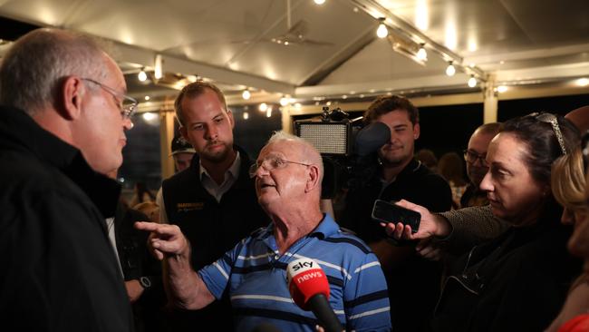 Prime Minister Scott Morrison with an angry member of the public at Newcastle’s Edgeworth Tavern. Picture: Damian Shaw