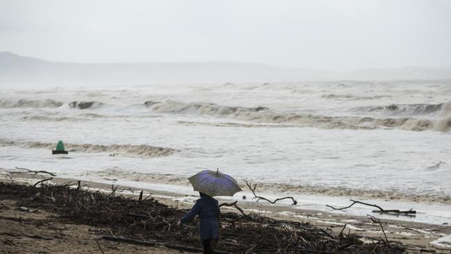 Charred debris from the bushfires washed onto the beach after the Shoalhaven River flooded. Picture: Brook Mitchell/Getty Images