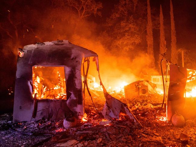 A home continues to burn as flames from the LNU Lightning Complex fire spread in Vacaville, California. Picture: AFP