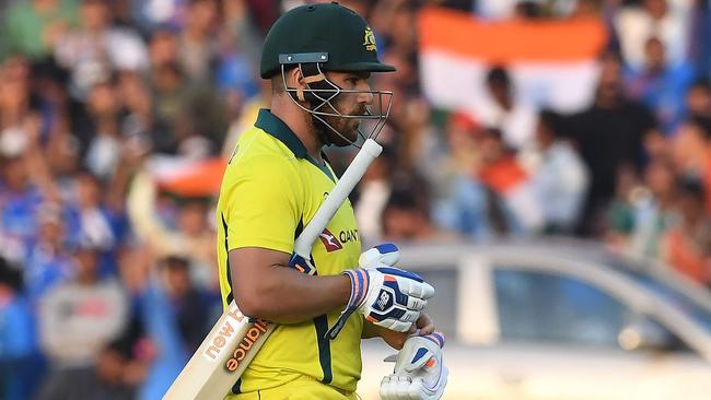 Australian captain Aaron Finch walks back to the pavilion after yet another duck