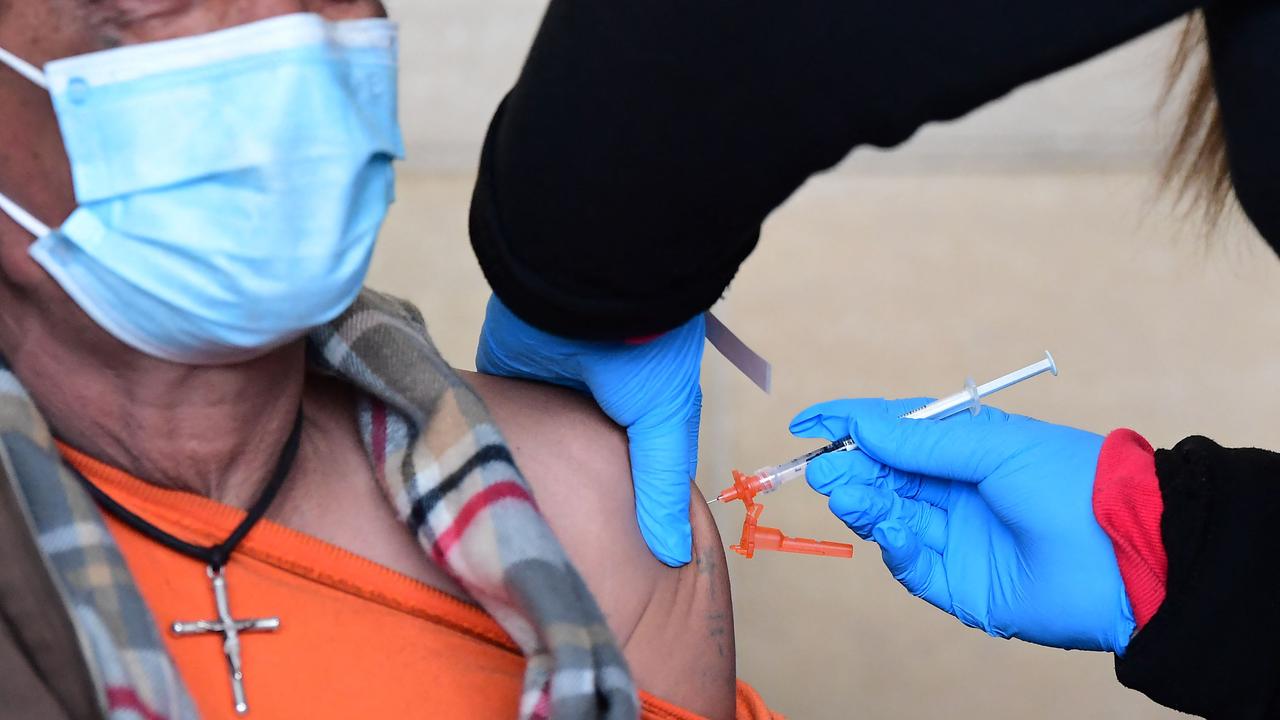 A man claims he received Covid vaccine doses at least eight times last year. Picture: Frederic J. Brown / AFP.