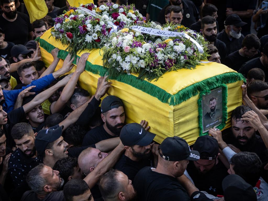 Men carry the coffin of Hezbollah fighter Husein Mohamad Choukair who was killed in an Israeli drone strike in southern Lebanon. Picture: Getty Images