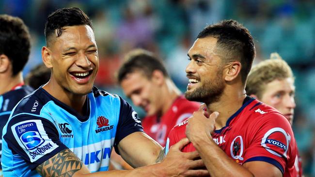 Israel Folau and Karmichael Hunt after a Waratahs-Reds game. Picture: Mark Evans