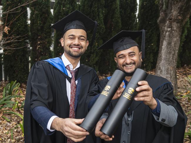 Bishal Bhandari (left) and Kamal Timsina celebrate graduating together with a Master of Science (Agricultural Science) at a UniSQ graduation ceremony at The Empire, Tuesday, June 25, 2024. Picture: Kevin Farmer