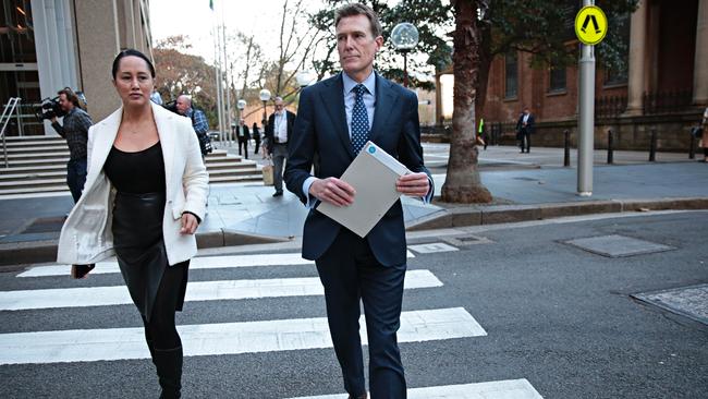 Christian Porter leaves court with his solicitor after dropping his case against the ABC. Picture: NCA NewsWire / Adam Yip