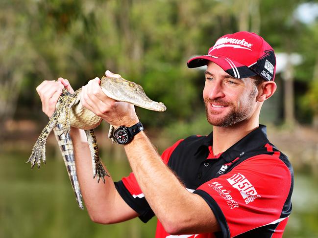 Supercars driver Will Davison holds seven year old Koala, Banjo as he visited Billabong Sanctuary. Picture: Zak Simmonds