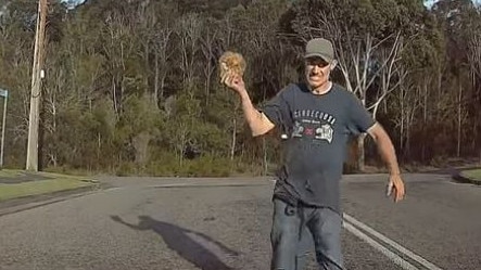 Still images taken from a dashcam video posted to Facebook of Shane Smith, 33, of Glenning Valley, just before he smashes a driver's side window. Picture: Facebook