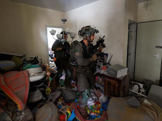 IDF soldiers checking the attacked kibbutz. Picture: Ziv Koren/Polaris/Headpress