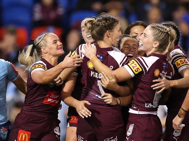 NEWCASTLE, AUSTRALIA - MAY 29: Romy Teitzel of the Maroons celebrates with team mates after scoring a try during game three of the Women's State of Origin series between the New South Wales Blues and Queensland Maroons at McDonald Jones Stadium on May 29, 2025 in Newcastle, Australia. (Photo by Cameron Spencer/Getty Images)