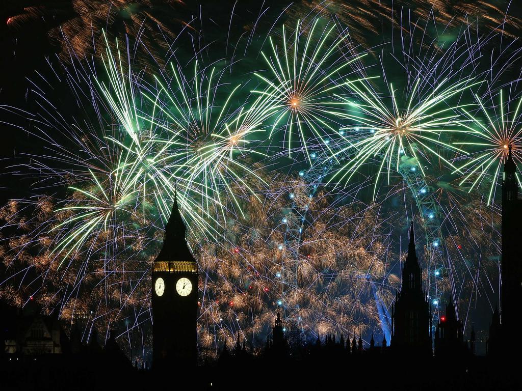 Fireworks explode around the London Eye and Big Ben. Picture: AFP