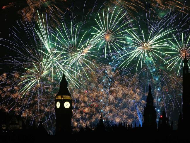 Fireworks explode around the London Eye and Big Ben. Picture: AFP