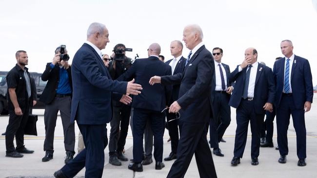 Israel Prime Minister Benjamin Netanyahu greets US President Joe Biden upon his arrival at Tel Aviv's Ben Gurion airport.