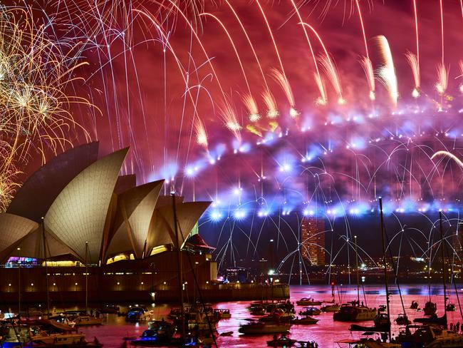 SYDNEY, AUSTRALIA - DECEMBER 31: Fireworks explode over the Sydney Harbour Bridge and the Sydney Opera House during the midnight show during New Year's Eve celebrations on December 31, 2018 in Sydney, Australia. (Photo by Brett Hemmings/Getty Images)