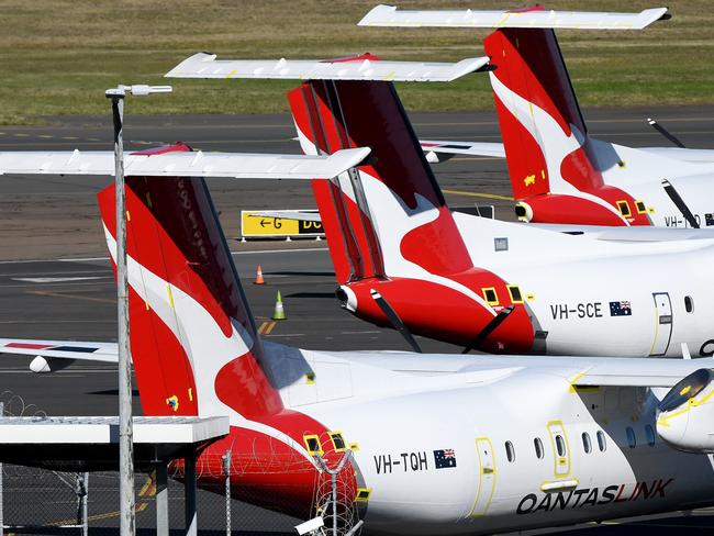 Grounded Qantas planes are seen at Sydney Airport in Sydney, Thursday, June 25, 2020. Qantas will cut at least 6,000 jobs across all parts of the business and continue to stand down 15000 employees as part of its plan to recover from the impact of the COVID pandemic. (AAP Image/Bianca De Marchi) NO ARCHIVING