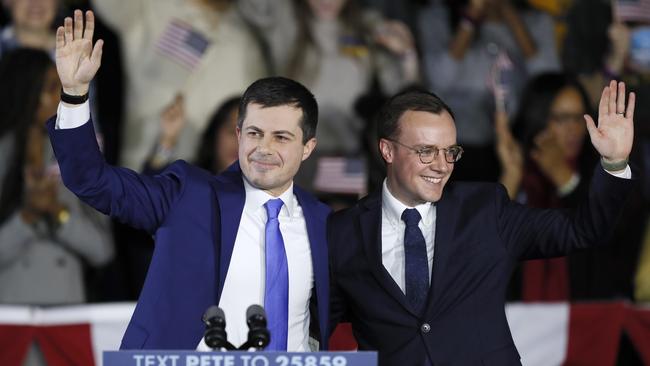 Democratic presidential candidate Pete Buttigieg, left, and his husband Chasten at a caucus night campaign rally in Des Moines, Iowa, on Monday. Picture: AP