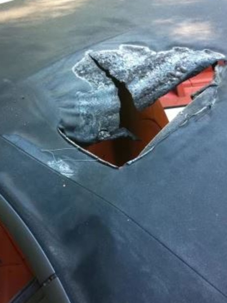 A hole in the roof of Scott “Kid Cudi” Mescudi’s Porsche which a molotov cocktail was allegedly thrown through. Picture: US Federal Court Southern District of New York