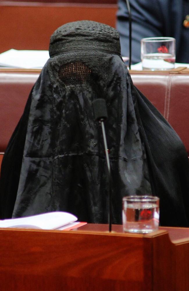 Senator Pauline Hanson was defiant as she sat in the chamber making her point. Picture: Gary Ramage