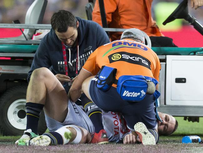 Shaun Fensom is injured during the NRL grand final between.