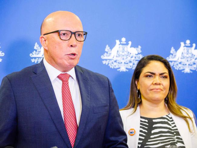 Shadow minister for Indigenous Australians Jacinta Nampijinpa Price (R) and Opposition Leader Peter Dutton attend a press conference following the results of Australia's historic Indigenous rights referendum, in Brisbane on October 14, 2023. Australians have roundly rejected greater rights for Indigenous citizens, scuppering plans to amend the country's 122-year-old constitution after a divisive and racially-tinged referendum campaign. (Photo by Patrick HAMILTON / AFP)