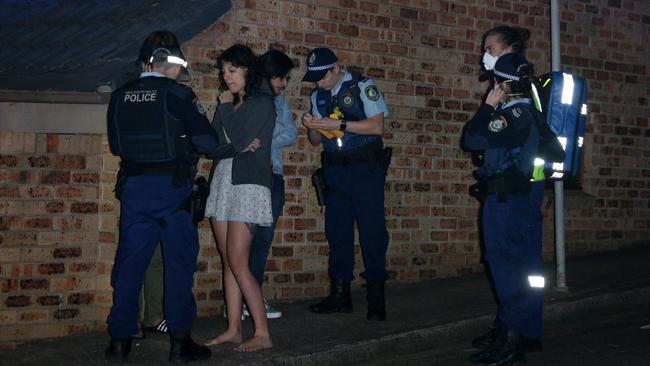 Police interview witnesses at the scene of the house fire in North Sydney. Picture: Matrix Media