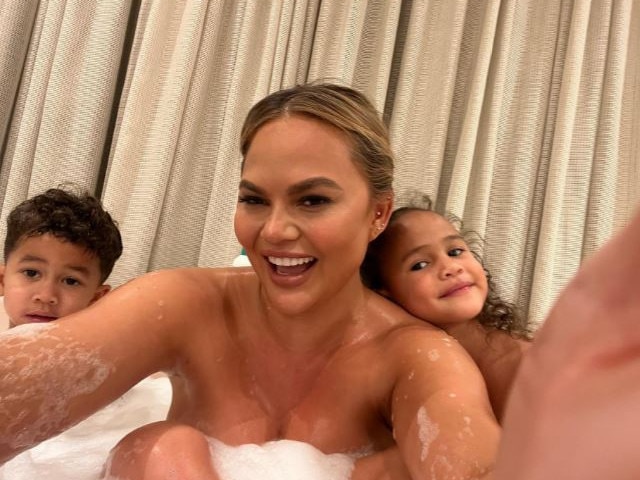 The photo shows Teigen in the bath smiling for the camera alongside daughter Luna and son Miles. Picture: Instagram/Chrissy Teigen