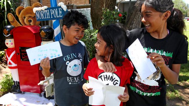 Nagaretman siblings, Michael 8, Amisha, 9 and Nishelle, 12, with their letters to Santa to drop off at the special mailbox at Linda Hernando’s home in Emu Plains. Picture: Toby Zerna